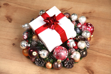 New Year gift on a golden tinsel background boly