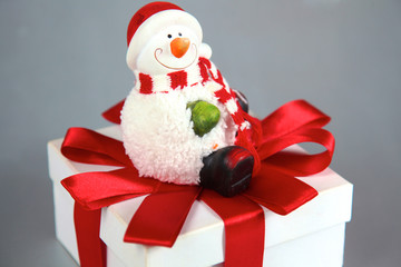 New Year gift on a golden tinsel background boly