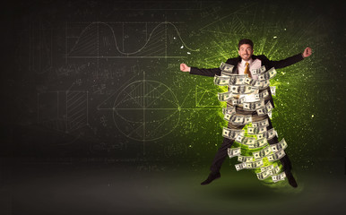 Cheerful businesman jumping with dollar banknotes around him