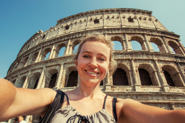 Woman on the background of the Colosseum