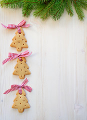 Christmas tree cookies on wooden background