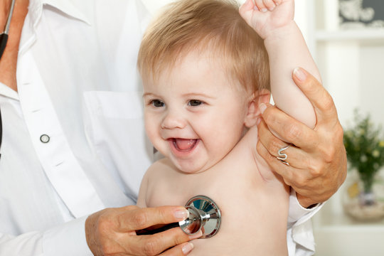 Happy Baby At Doctor With Stethoscope