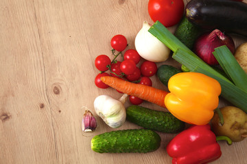 Pile of organic vegetables on a wooden table