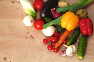 Pile of organic vegetables on a wooden table
