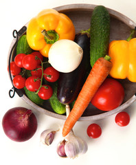Fresh autumn vegetables on a white background