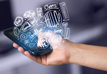 Hand holding phone with hand drawn speech bubbles