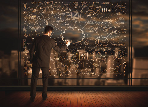 Businessman drawing business plan