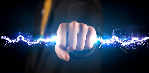 Business man holding electricity light bolt in his hands