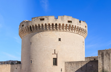 Fototapeta na wymiar ruins of medieval old tower of castle under blue sky