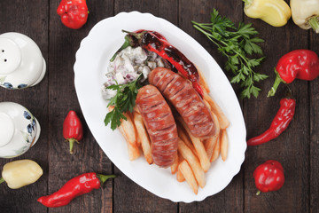 Grilled sausages and french fries