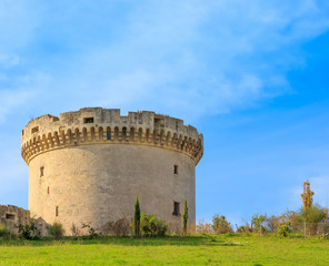 Fototapeta na wymiar ruins of medieval old tower of castle under blue sky with cloud