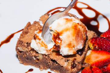 Delicious Brownie With Ice Cream And Strawberry
