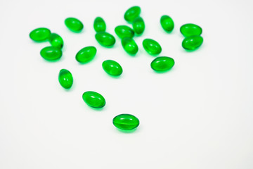 green pills soft gel capsule isolated on white background