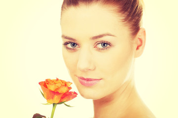 Fototapeta premium Smiling woman with fresh rose.