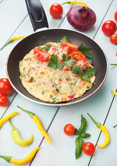Omelet with cheese and cherry tomato