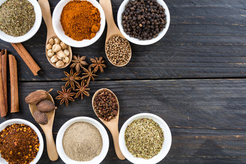 Spices and herbs in  bowls.