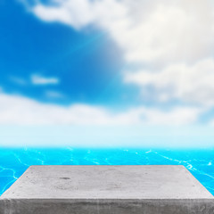 Obraz premium concrete table on blue sea & sky background can put or montage your products for display