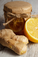 Fresh lemon, honey and ginger on wooden table, healthy food