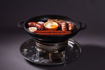 sausages and mushrooms on the grill 