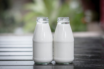 Bottles of milk on the wood