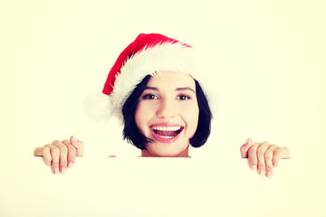 Santa girl holding blank board