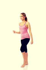 Fototapeta na wymiar Young woman doing aerobic exercise.