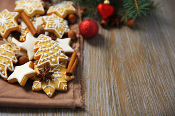 Cookies with spices and Christmas decor, on wooden table