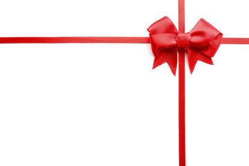 Shiny red ribbon with bow isolated on white
