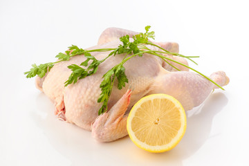 whole raw chicken with parsley