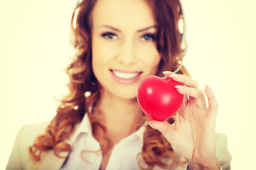 Call center woman with heart toy.