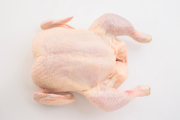 whole raw chicken isolated on white