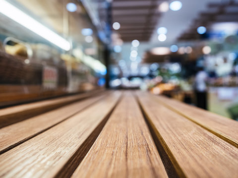 Table top with Blurred Retail shop store Background