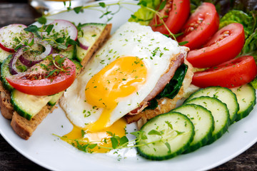 Morning Breakfast - vegan toast sandwich, egg, bacon, and vegetables