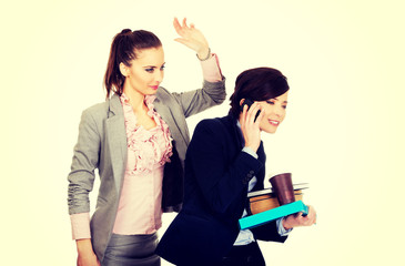 Woman try to get attention from her busy partner.