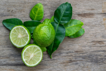 Bergamot with green leafs on wood background