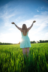 Happiness woman stay outdoor under sunlight of sunset