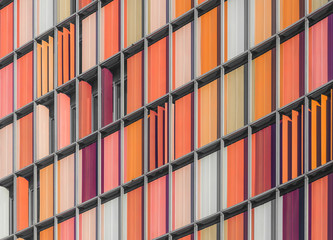 An abstract view of a colorful blinds on a high rise.