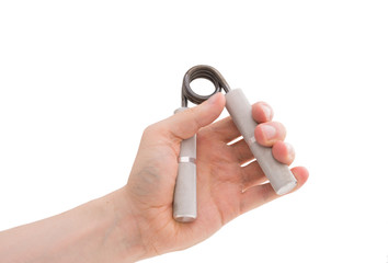Male hand exercising grip strength using a metal hand gripper