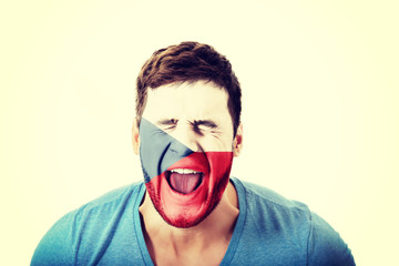 Man with Czech Republic flag on face.