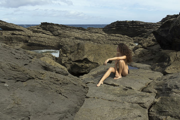 pretty girl posing in the coast