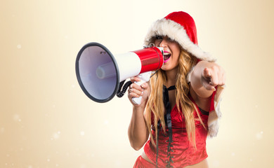 Christmas woman shouting by megaphone