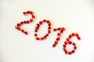 The inscription 2016 New Year. Berry Pomegranate.