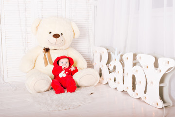 Portrait of baby with teddy bear 