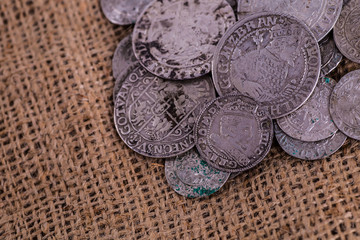 trove of ancient medieval coins silver background