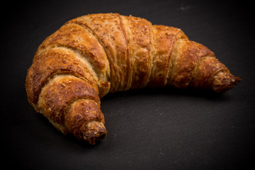 Croissant on dark plate