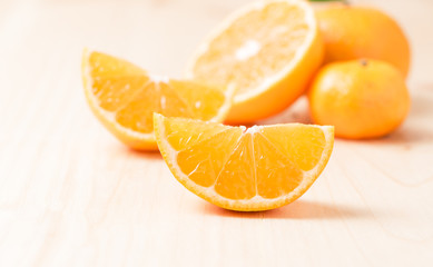 slice orange fruit on wood background