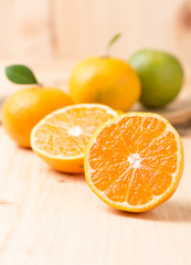 slice orange fruit on wood background