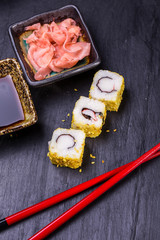 Closeup of fresh sushi on rustic wooden table