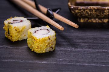 Closeup of fresh sushi on rustic wooden table