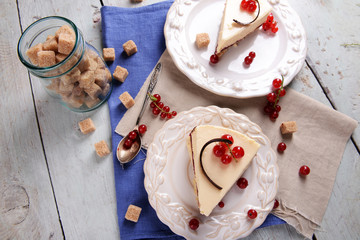 Tasty cheesecake with berries on table close up